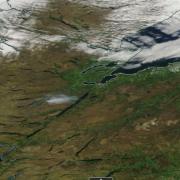 Satellite images from Nasa show the plume of smoke from the blaze drifting towards the loch