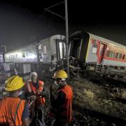 Ten to 12 coaches of one train derailed, and debris from some of the mangled coaches fell onto a nearby track.