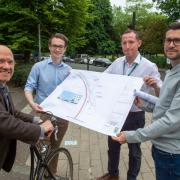 Minister for Active Travel Patrick Harvie, Cllr Angus Millar and the Glasgow City Council project team look at the design map for the Connecting Battlefield Active Travel Project