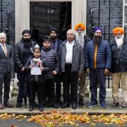 Members of the Free Jaggi Now Campaign hand in a petition to 10 Downing Street