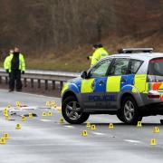 Tayside Police investigation team search the southbound carriageway of the A9 near Auchterarder