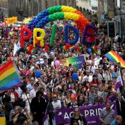Pride marchers going up the Royal Mile in Edinburgh