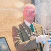Stirling provost Douglas Dodds pictured holding the Wallace sword