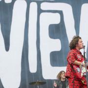 Kyle Falconer appeared on stage wearing a bright red Umbro two-piece
