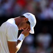 Andy Murray looks dejected during his match against Stefanos Tsitsipas (Steven Paston/PA)
