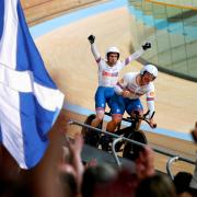 Scotland's Neil Fachie celebrates winning gold with teammate Matt Rotherham as pilot