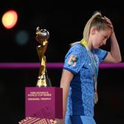 Keira Walsh walks by the Women's World Cup trophy following England's loss in the final to Spain