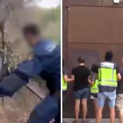 Video from Spanish police on social media showed people being arrested after a hidden barrel was discovered above a road