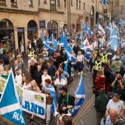 Pro-independence supporters march down the Royal Mile