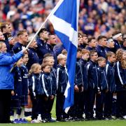 Scotland players stand for the national anthem ahead of the Summer Nations Series match at the Scottish Gas Murrayfield Stadium
