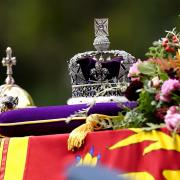 The State Gun Carriage carries the coffin of Queen Elizabeth II, draped in the Royal Standard with the Imperial State Crown and the Sovereign's orb and sceptre, in the Ceremonial Procession following her State Funeral at Westminster Abbey, London.