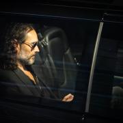 Russell Brand pictured leaving a gig in London on Sunday, after serious allegations were made against him