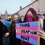 Trans rights activists take part in a demonstration outside Portobello Library, Edinburgh