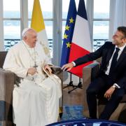 Emmanuel Macron is facing questions over attending a mass amid religious debates in France