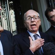 Rupert Murdoch speaks to the media outside a hotel in London