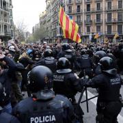 Mossos d'Esquadra officers clash with pro-independence supporters trying to reach the Spanish government office in Barcelona, March 25, 2018