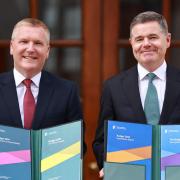 Minister for Finance Michael McGrath, left, and Minister for Public Expenditure Paschal Donohoe arrive at Leinster House in Dublin, to unveil the Government’s Budget (Liam McBurney/PA)