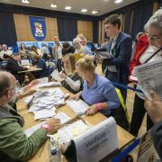 Votes are counted in the count hall at the South Lanarkshire Council Headquarters in Hamilton for the Rutherglen and Hamilton West by-election