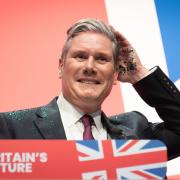 Keir Starmer speaking at Labour's conference, where Union flags were on show in all corners