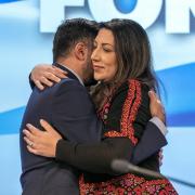 Nadia El-Nakla embraces her husband Humza Yousaf after delivering an emotional speech on the situation in Gaza