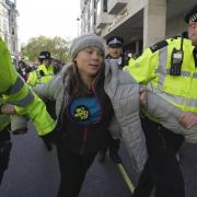Images showed Greta Thunberg being led away by police