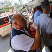 Palestinians injured in Israeli air raids arrive at Nasser Medical Hospital in Khan Yunis, Gaza