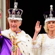 King Charles III and Queen Camilla on the balcony of Buckingham Palace following the coronation