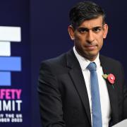 Rishi Sunak pictured making the closing speech of the AI Safety Summit in Bletchley Park