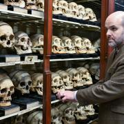 Tom Gillingwater in the University of Edinburgh Skull Room as the skulls of four Taiwanese tribal warriors killed nearly 150 years ago are repatriated