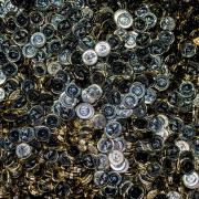 Thousand of newly minted £1 coins collect in a bin at the Royal Mint