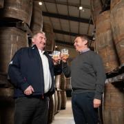 SWI managing director Keith Rennie (left) and business operations manager Barry Anderson (right) toast the new development