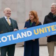 Alba politicians Neale Hanvey, Ash Regan and Kenny MacAskill pose outside Holyrood