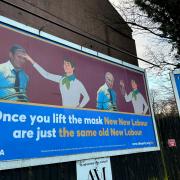 The billboard shows Keir Starmer as Tony Blair in disguise