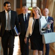 Deputy First Minister Shona Robison alongside First Minister Humza Yousaf as they make their way to the chamber to outline the draft budget for 2024-25 in a statement to MSPs in the Scottish Parliament