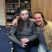 Katie Robertson was presented with a new set of bagpipes thanks to an anonymous benefactor