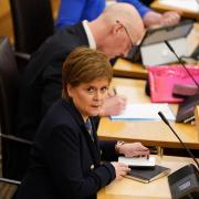 Nicola Sturgeon MSP and John Swinney MSP during First Minster's Questions at the Scottish Parliament in Holyrood