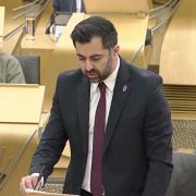 Humza Yousaf was spotted wearing a pink and purple badge at FMQs