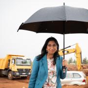 Suella Braverman at a ground-breaking ceremony to mark the beginning of construction for a new building project of 500 apartments in Kigali