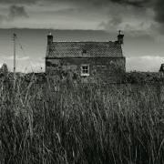 Grayscale image of a croft near Kinlochbervie in the Highlands. Photo: Unsplash