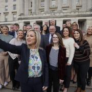 Northern Ireland First Minister Michelle O'Neill takes a photo with her Sinn Fein MLA colleagues at Stormont