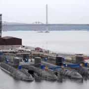 Decommissioned nuclear submarines alongside the Royal Navy's new aircraft carrier HMS Queen Elizabeth, at Rosyth Dockyard in Dunfermline