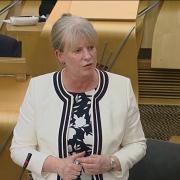 Deputy First Minister Shona Robison attacked the Tories for a 'new age of austerity' as MSPs voted on the Scottish Budget