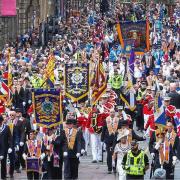 The organiser behind a proposed Orange Order march is being investigated over social media posts