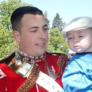 Murdered soldier Lee Rigby pictured with his son. Rigby's widow Rebecca has urged for an end to anti-Muslim hate