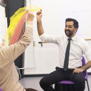 First Minister Humza Yousaf takes part in a dance performance during a visit to DN Studios