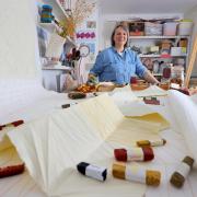Charlene Scott, 52, in her studio at home with some of her work
