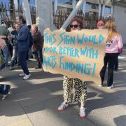 A protester calling on the Scottish Government to reinstate £6.6 million of Creative Scotland funding