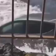 The car was engulfed by waves