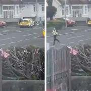Video shared on social media showed police running and a man apparently carrying a chainsaw