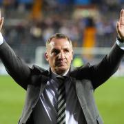 Brendan Rodgers salutes the Celtic fans at Rugby Park after the Parkhead club's third consecutive Scottish title victory
